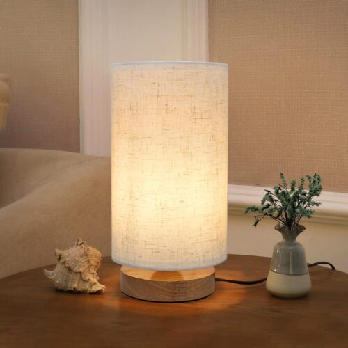 Small minimalist bedside table lamp with round linen shade